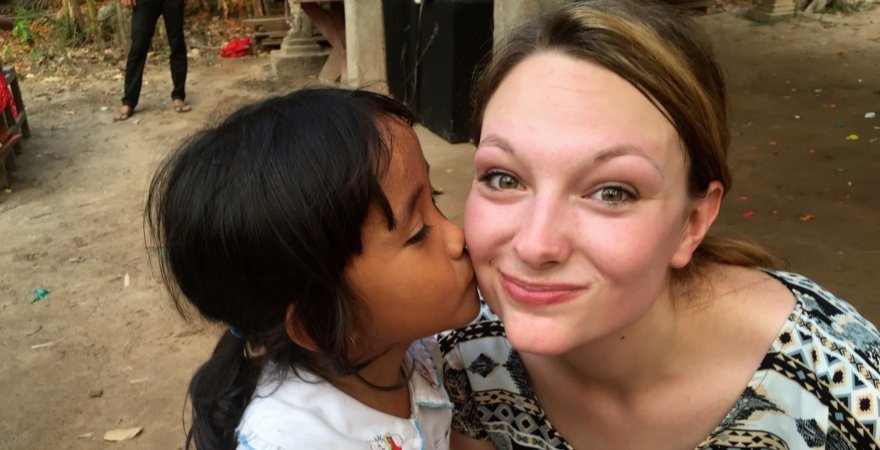 "Dr. C's daughter with Cambodian student"