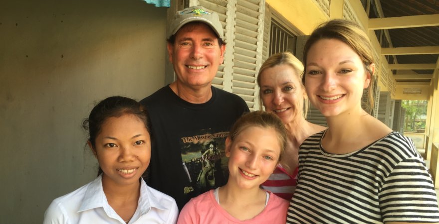 "Dr. C's family with Cambodian teacher"